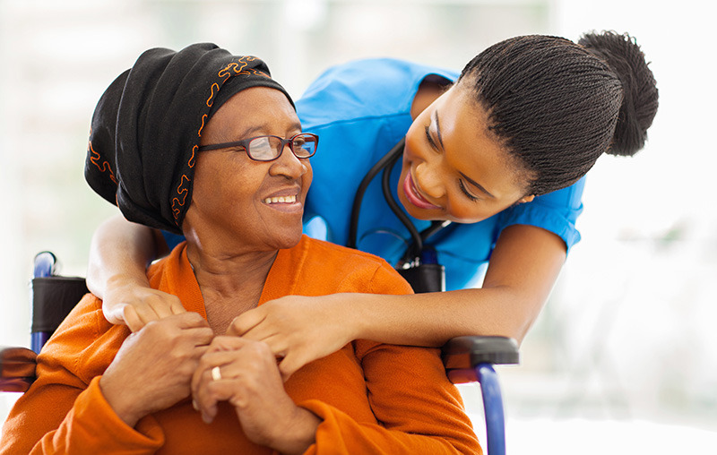 a health care professional with a patient